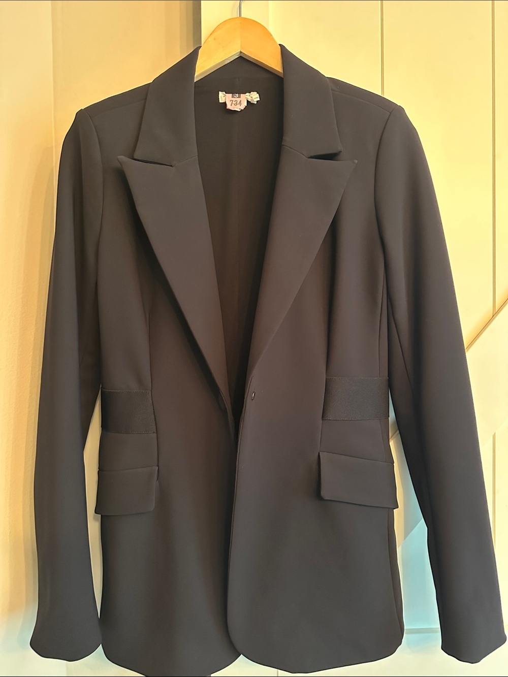Good American black blazer with waist detail.